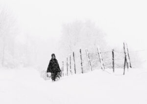 Amish girl in snowstorm